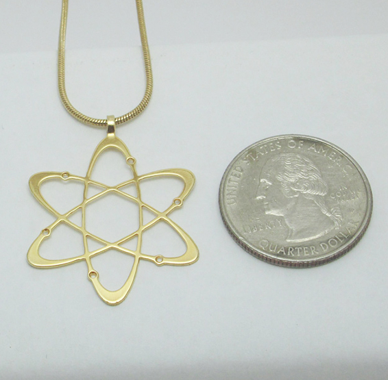 Carbon atom gold coin