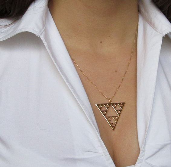 Sierpinski triangle fractal geometry gold necklace on a model by Delftia science jewelry